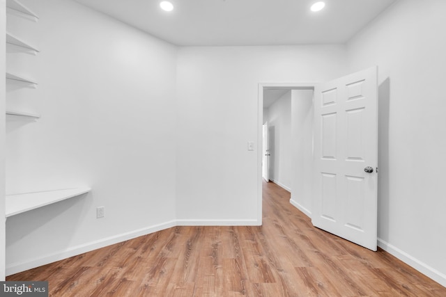 empty room with light hardwood / wood-style floors