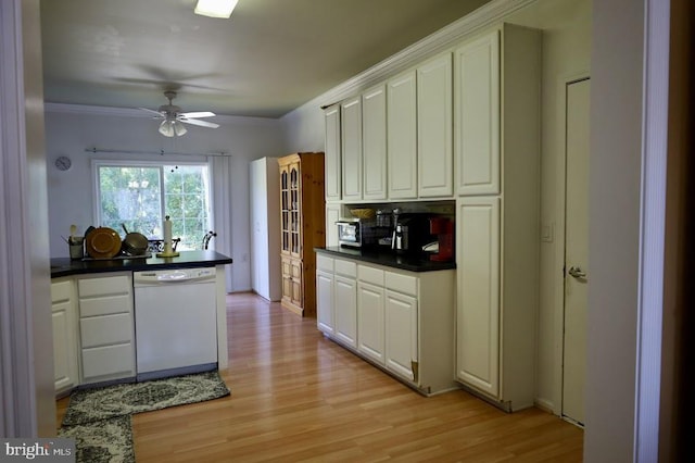 kitchen with white dishwasher, white cabinetry, and light hardwood / wood-style flooring