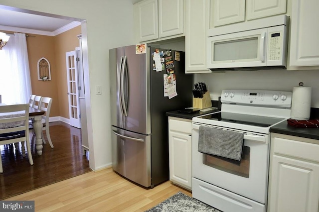 kitchen featuring ornamental molding, light hardwood / wood-style floors, white appliances, and white cabinetry