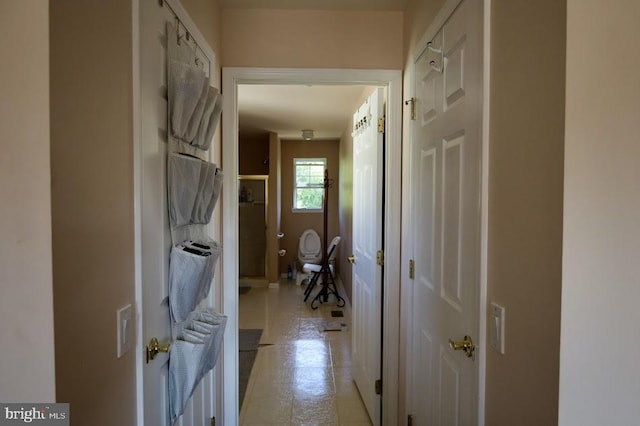 hallway with light tile patterned floors