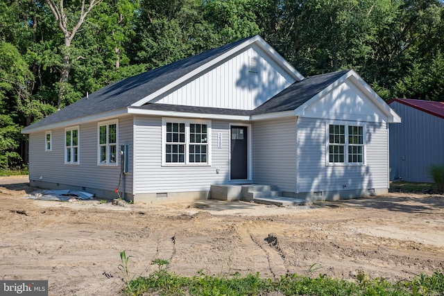 view of front of property with crawl space and a shingled roof