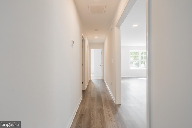 hall with light wood-type flooring