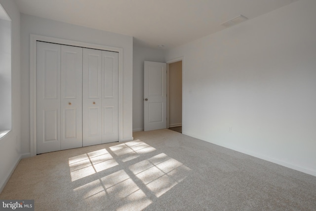 unfurnished bedroom featuring a closet