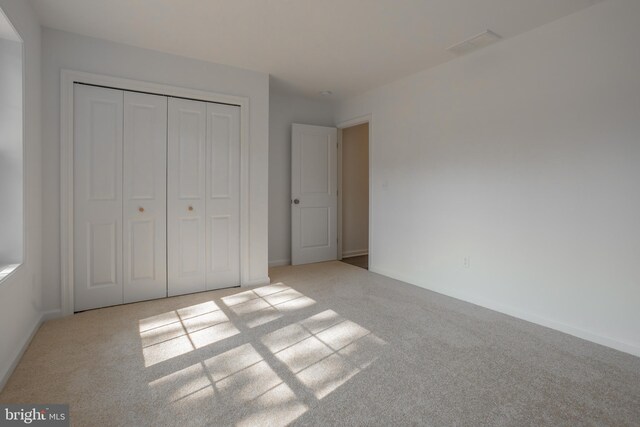 34709 Bowman Ln, Frankford, DE 19945 - unfurnished bedroom with carpet, a closet, and baseboards