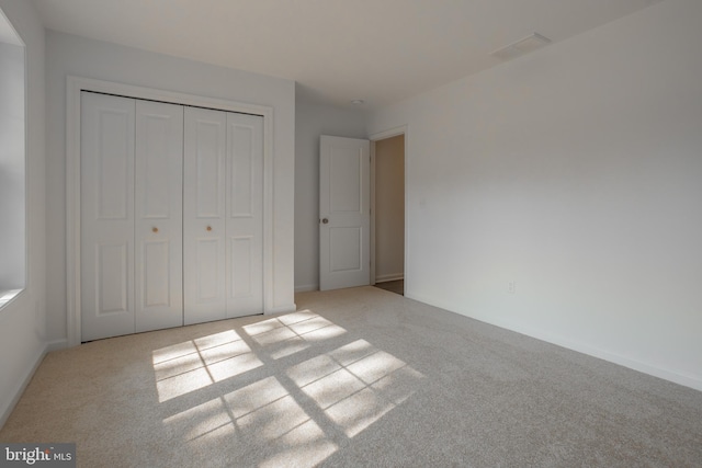 34709 Bowman Ln, Frankford, DE 19945 - unfurnished bedroom featuring carpet floors, a closet, and baseboards