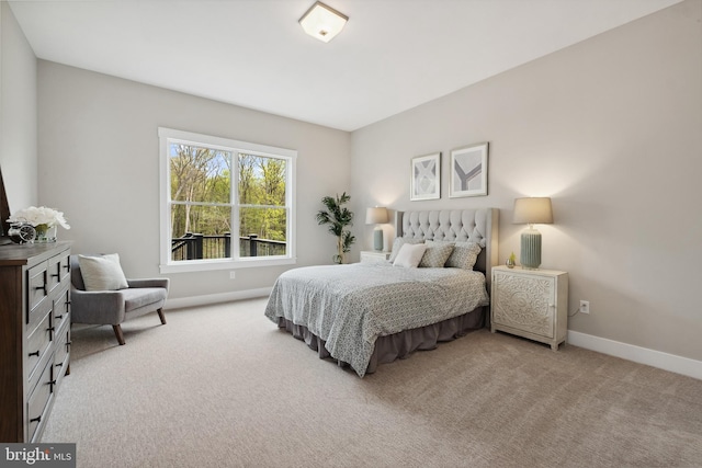 bedroom featuring light carpet