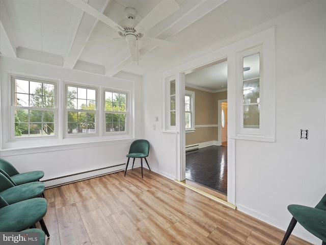 sunroom with a baseboard heating unit, beam ceiling, and ceiling fan