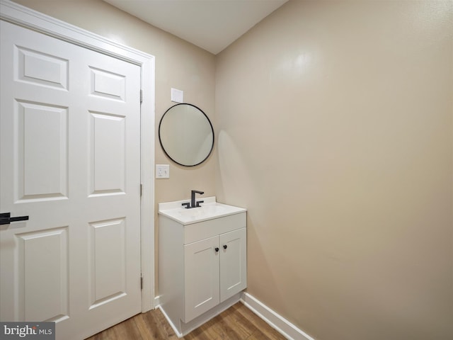 bathroom with wood-type flooring and vanity