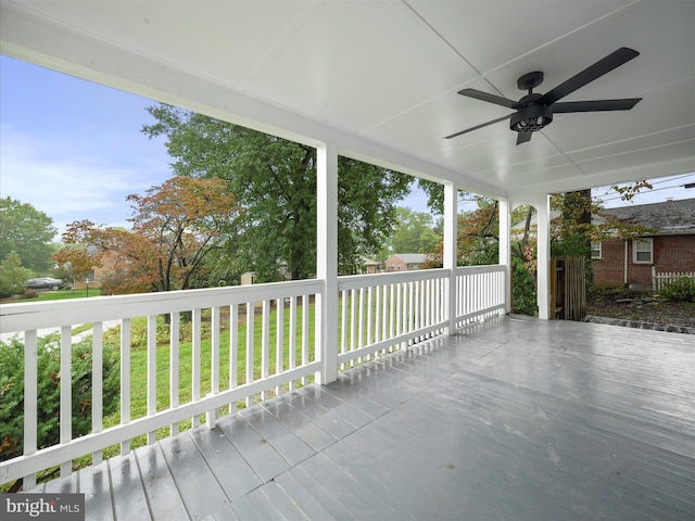 wooden deck featuring ceiling fan