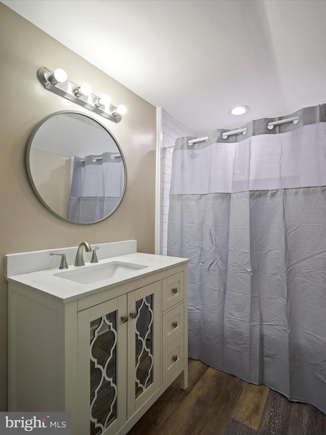 bathroom with wood-type flooring and vanity