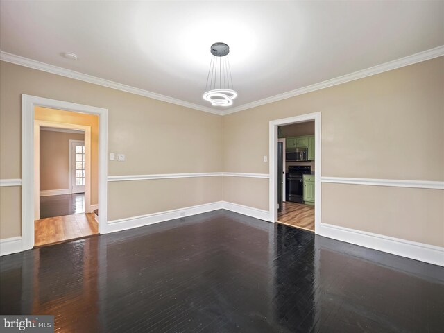 unfurnished room with hardwood / wood-style flooring and ornamental molding