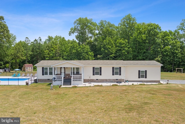 view of front of property featuring covered porch and a front yard