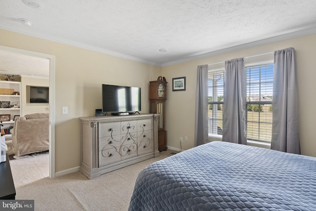 bedroom featuring a textured ceiling, crown molding, and light colored carpet