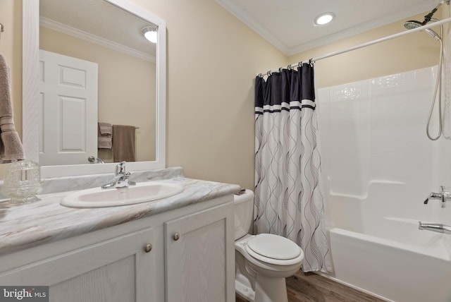 full bathroom featuring vanity, shower / tub combo, toilet, and crown molding