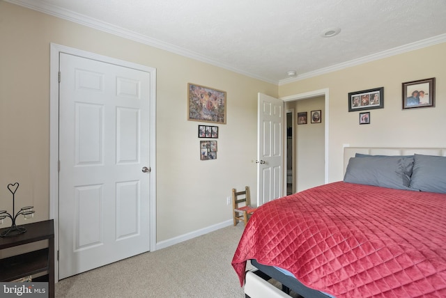 carpeted bedroom with a textured ceiling and ornamental molding