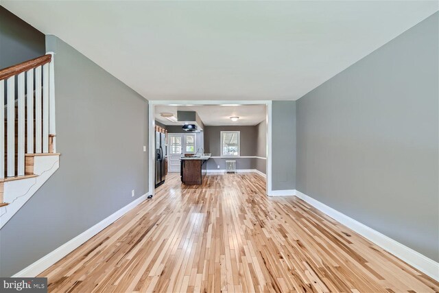 unfurnished living room with light wood-type flooring