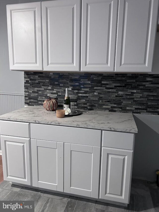 1128 Everett St, Camden, NJ 08104 - interior space featuring white cabinets and backsplash