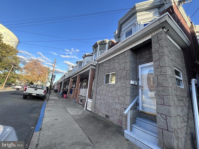 1128 Everett St, Camden, NJ 08104 - view of side of home featuring crawl space, entry steps, and stone siding