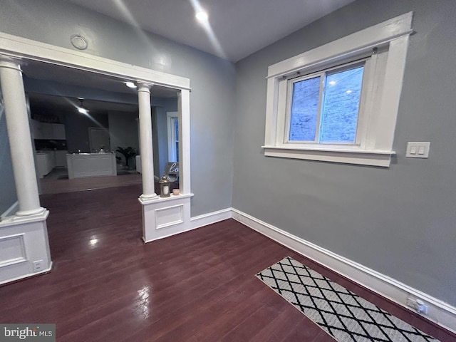 spare room with dark wood-type flooring