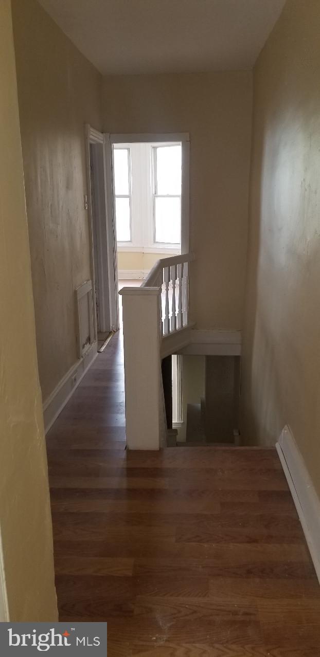 hall featuring dark hardwood / wood-style floors