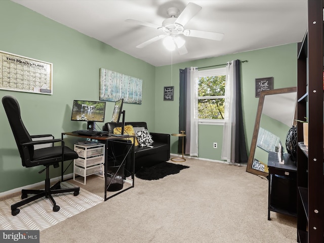 carpeted office space with ceiling fan