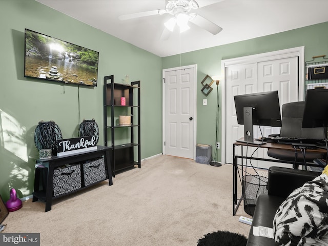 office with light carpet and ceiling fan