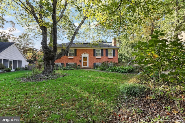 bi-level home with a front yard