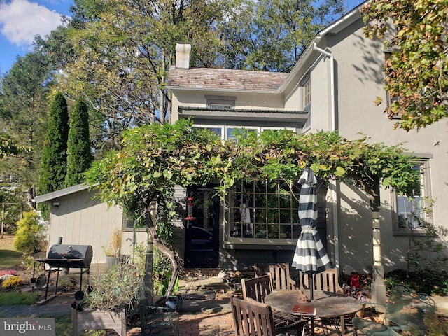 back of property featuring a patio