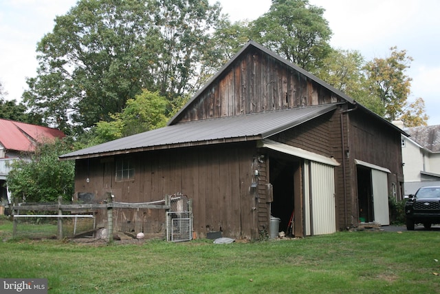 view of side of home with a lawn