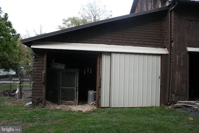 view of outdoor structure with a lawn