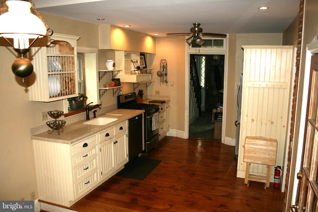 kitchen with ceiling fan, dark hardwood / wood-style floors, sink, and black appliances