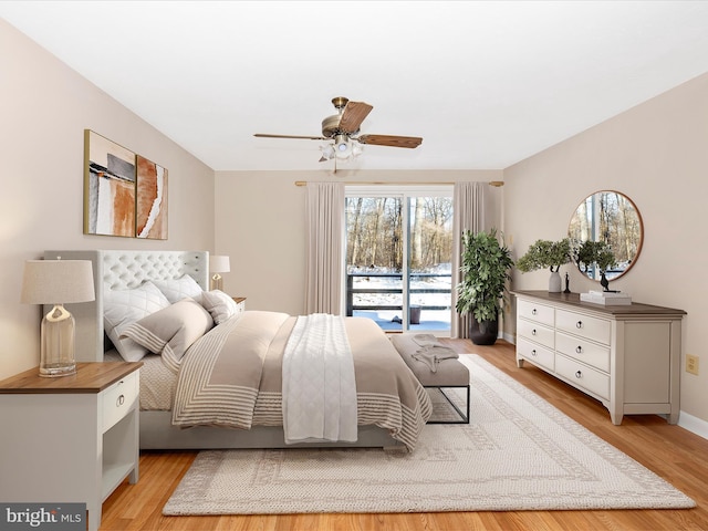 bedroom featuring ceiling fan, access to exterior, and light hardwood / wood-style floors