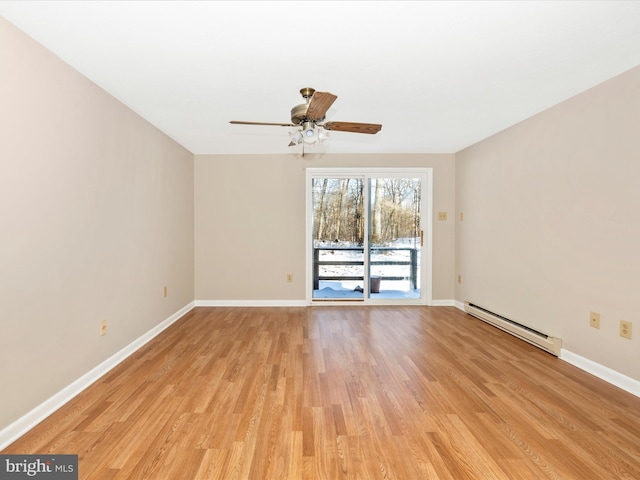 unfurnished room with baseboard heating, ceiling fan, and light hardwood / wood-style flooring