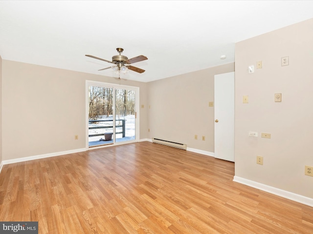 spare room with baseboard heating, ceiling fan, and light hardwood / wood-style flooring