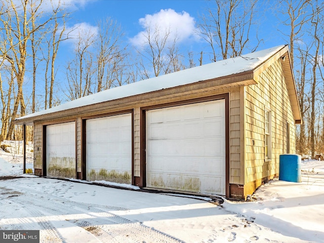 view of snow covered garage