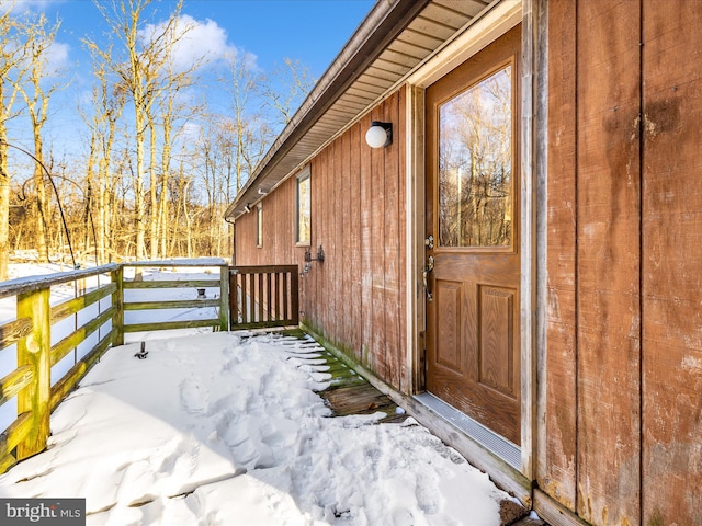 view of snow covered property entrance