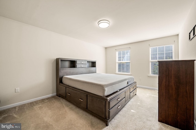 bedroom featuring light colored carpet