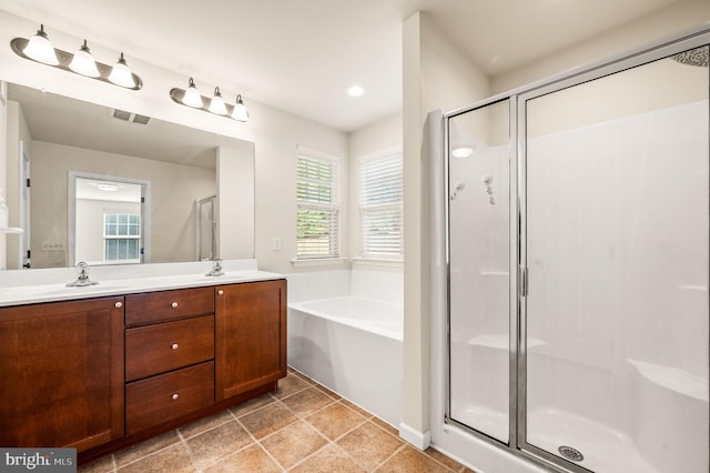 bathroom featuring independent shower and bath and vanity