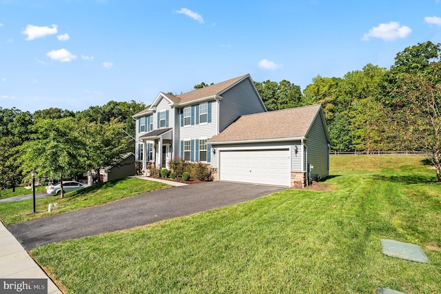 view of front facade with a garage and a front lawn