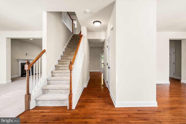 staircase featuring hardwood / wood-style floors