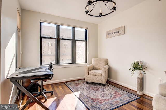 office featuring an inviting chandelier and hardwood / wood-style flooring