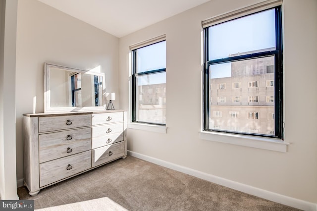 unfurnished bedroom featuring light colored carpet