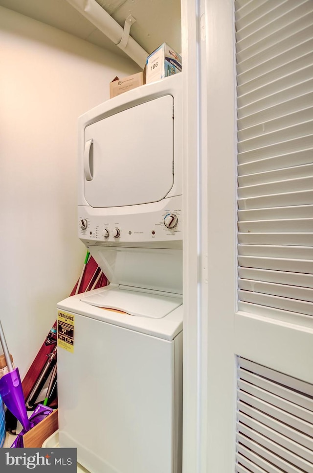 laundry room featuring stacked washer / dryer