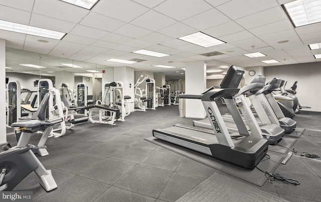 gym featuring a paneled ceiling