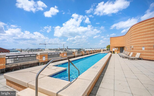 view of pool featuring a patio area