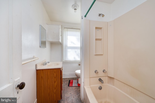 full bathroom featuring tub / shower combination, vanity, toilet, and tile patterned floors