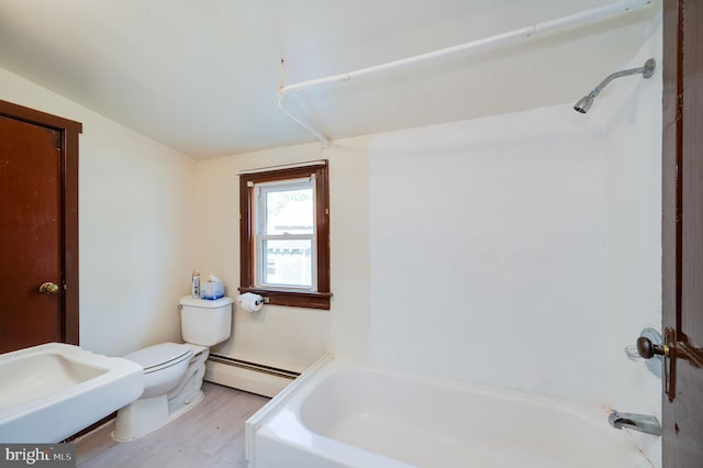 full bathroom with toilet, hardwood / wood-style floors, a baseboard heating unit, washtub / shower combination, and vaulted ceiling