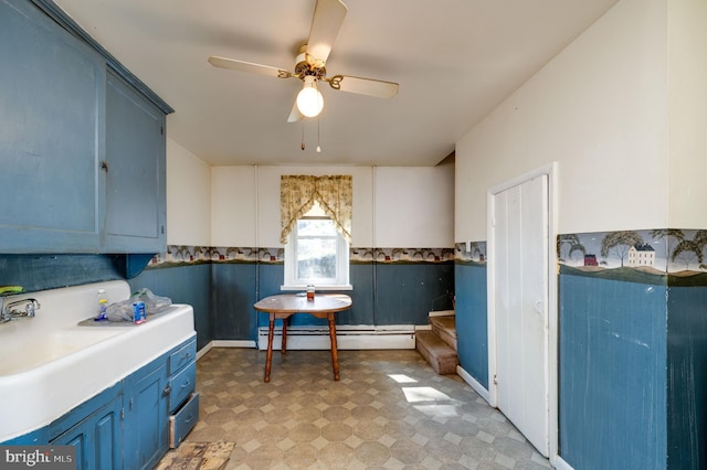 interior space featuring ceiling fan and a baseboard heating unit