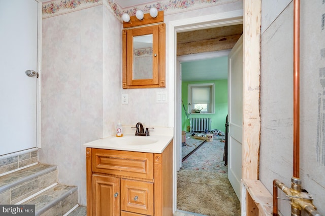 bathroom featuring radiator and vanity