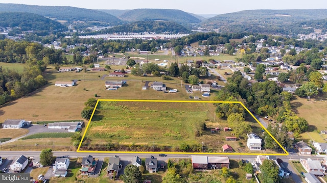 birds eye view of property featuring a mountain view